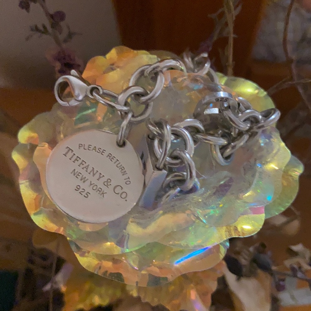 Tiffany bracelet with charms. Tiffany box charm is included with purchase.